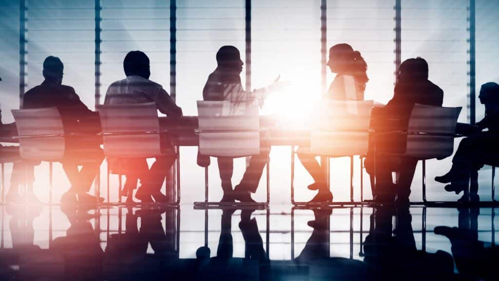 Group of business people sitting at a conference table